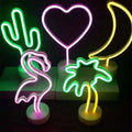 Neon sign set with glowing green cactus, pink flamingo, purple heart, yellow crescent moon, and neon palm tree led neon lights creating perfect ambiance