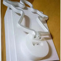 White led neon lights shaped like a stylized angel with glowing edges on a circular base for perfect ambiance
