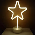 A glowing white led neon lights star-shaped lamp with slender stem and base creating perfect ambiance