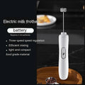 White handheld battery version milk frother with silver ornate whisk head and sleek ergonomic design cylindrical body