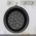 Black silicone ice basin with honeycomb-patterned interior featuring green honeycomb collapsible silicone design