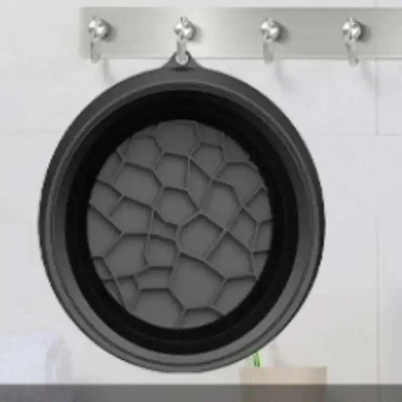 Black silicone ice basin with honeycomb-patterned interior featuring green honeycomb collapsible silicone design