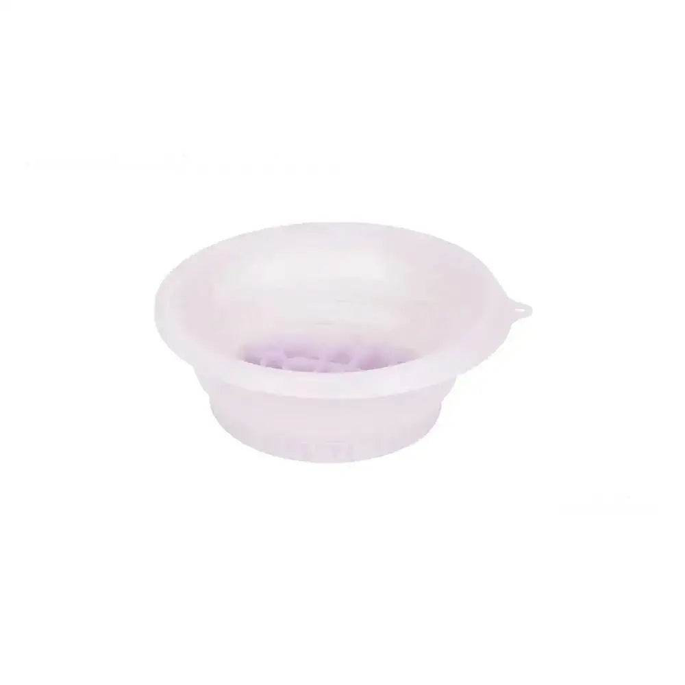 Translucent white silicone mixing bowl with a small spout for the green honeycomb collapsible silicone ice basin