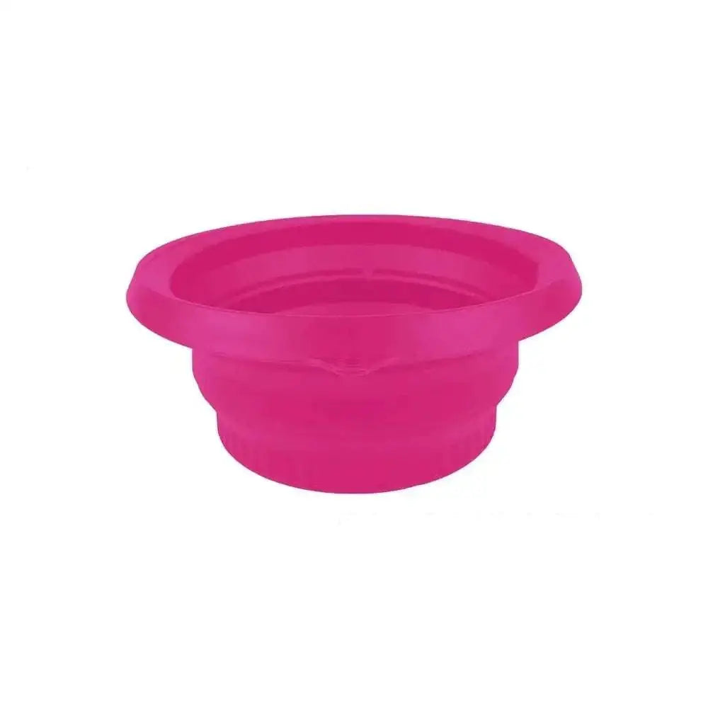 A vibrant pink collapsible silicone ice basin with smooth flexible surface and concentric ridges in green honeycomb collapsible style