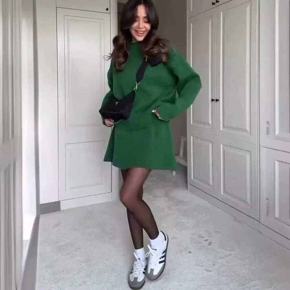 Green long sleeve knit casual sweater skirt set featuring an oversized sweater dress with flared skirt and ribbed cuffs