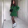 Green long sleeve knit casual sweater skirt set with black collar and matching belt detail in sweater dress style