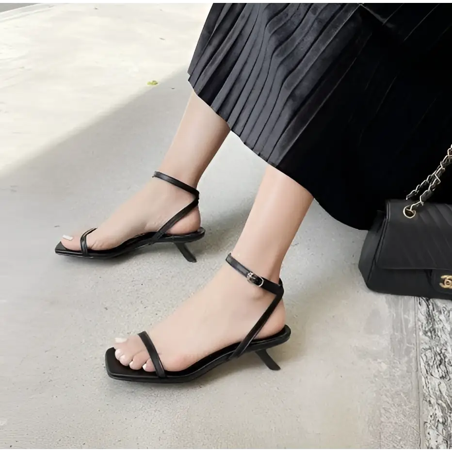 Black leather minimalist square toe block heel sandals with low kitten heel and ankle strap for elegant wear