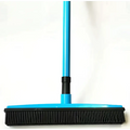 Blue plastic hair removal broom with black rubber bristles designed for pet hair removal and washable mop head use