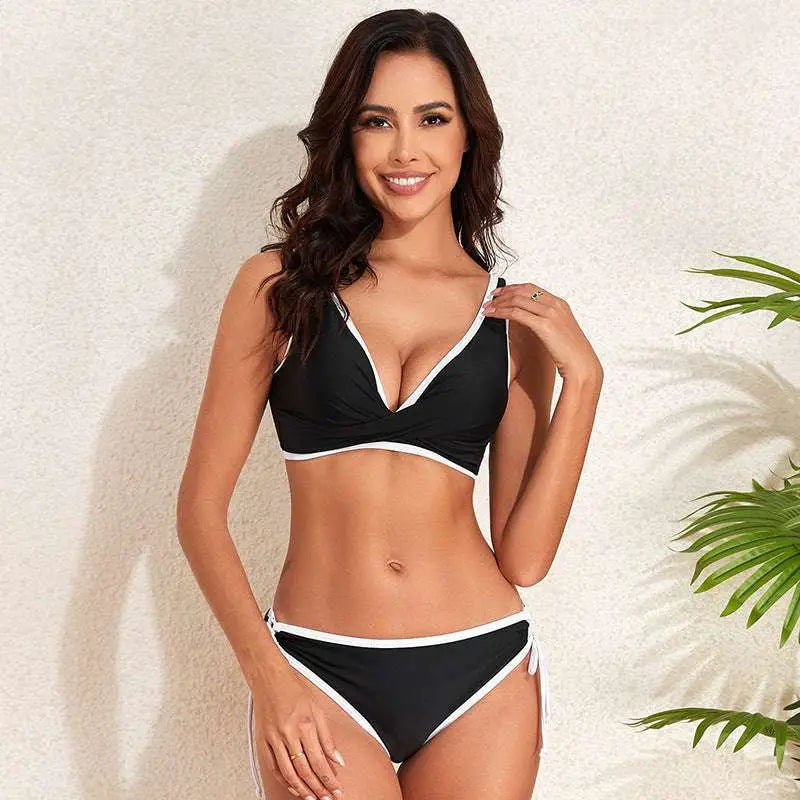 Black and white two-piece bikini with plunging neckline and high-waisted bottoms in green white bikini fashion split style