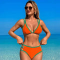 Vibrant orange and green white two-piece bikini fashion split swimsuit with thin straps and side cutouts
