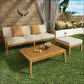 Beige cushioned grenada l shape sofa set with acacia wood frame and two mustard yellow patterned throw pillows