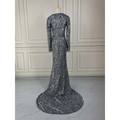 Grey long sleeve sequin mermaid evening dress featuring a shimmering silver sequined fabric and a flowing train