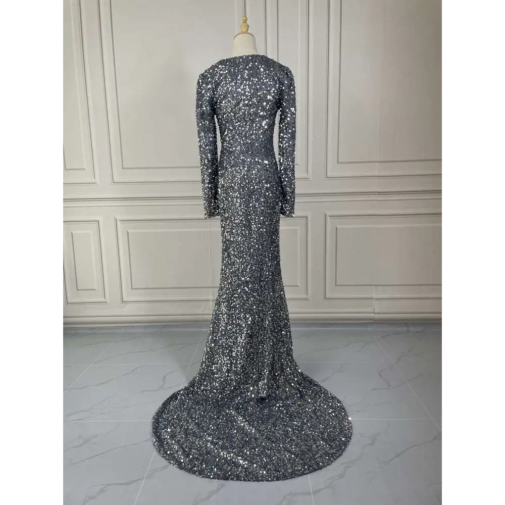 Grey long sleeve sequin mermaid evening dress featuring a shimmering silver sequined fabric and a flowing train