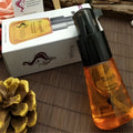 The bottle of rtopr moroccan hair care essential oil features a black pump and transparent glass with golden-orange liquid
