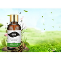 A brown glass hair care scalp liquid nutrient bottle with gold cap and white label featuring green accents and chinese text