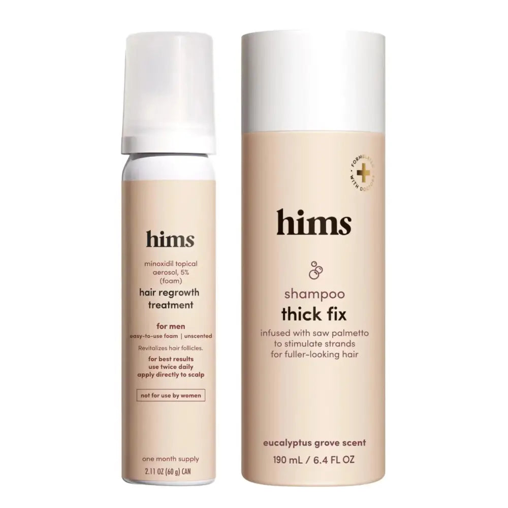 The hims mens hair growth set includes a white minoxidil topical aerosol and beige shampoo thick fix for fuller-looking hair