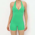A vibrant green halter neck high yoga romper featuring a deep v-cut neckline and short legs one-piece swimsuit