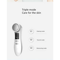 White handheld digital iontophoresis personal care device with circular treatment head and digital display screen