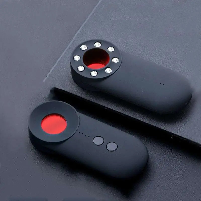Handheld positioning gps detector wifi device with black matte finish and red circular button with silver accents