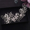 Handmade environmentally friendly silver floral headpiece with delicate leaf wirework embedded with crystals and rhinestones