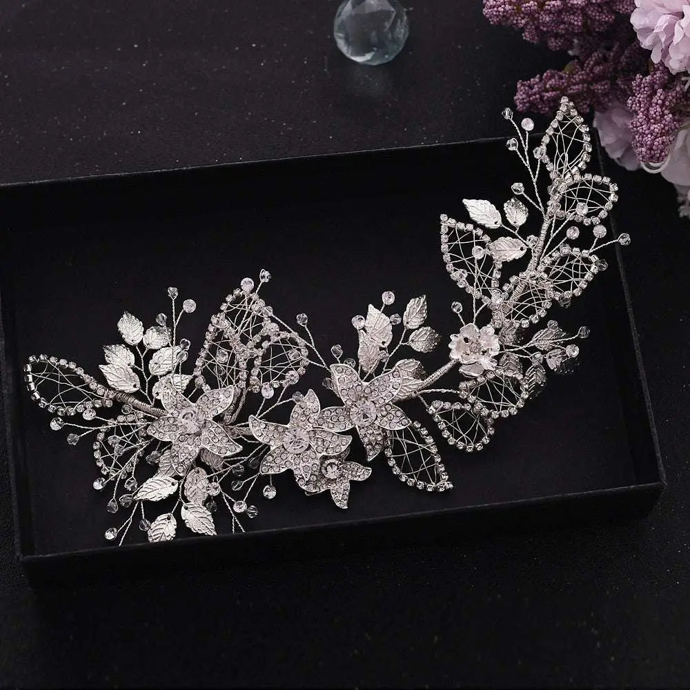 Handmade environmentally friendly silver floral headpiece with delicate leaf wirework embedded with crystals and rhinestones