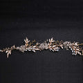 Delicate handmade hairband gold featuring a rose gold floral gold leaf headdress with crystals and light blue gemstones