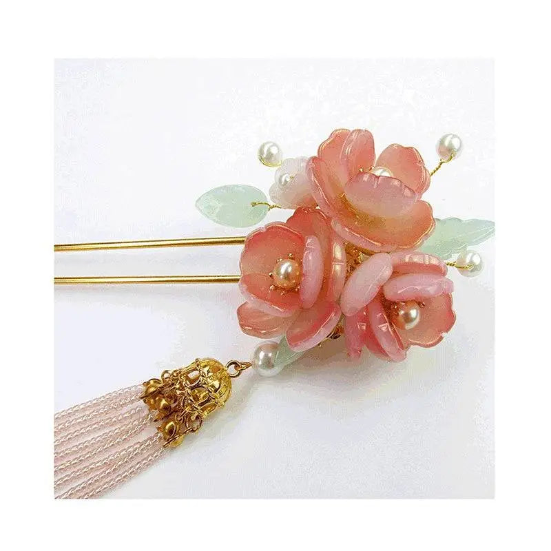 Handmade hanfu hairpin featuring a delicate pink floral design with pearl accents and a gold-toned pink floral tassel