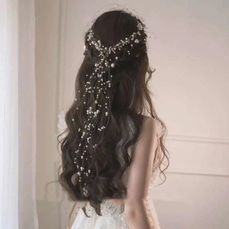 Delicate silver beaded hair pearl fairy bridal headdress with pearls and crystals cascading down long dark hair back