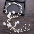 Handmade white pearl fairy bridal headpiece with delicate beaded hair design and translucent floral wirework accents
