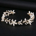 A delicate gold-toned handmade pearl twisted headwear with white pearl flowers and leaves for elegant wear