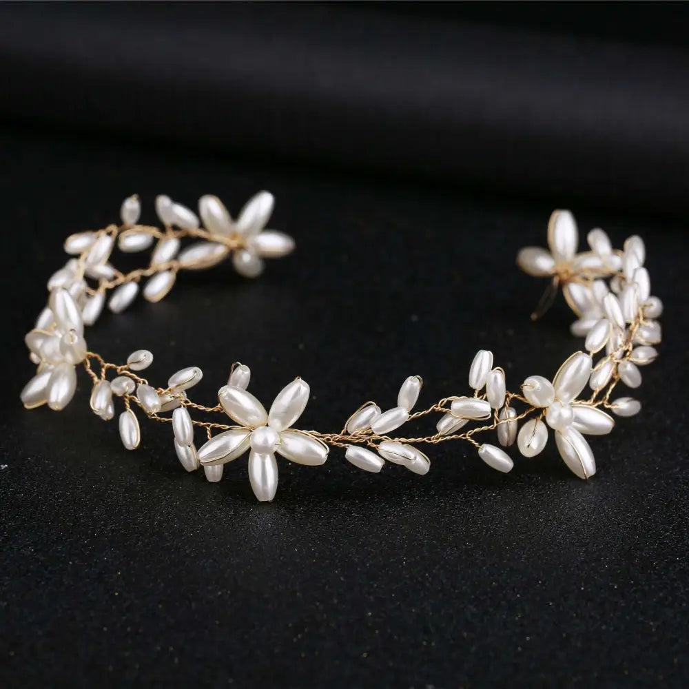 A delicate gold-toned handmade pearl twisted headwear with white pearl flowers and leaves for elegant wear