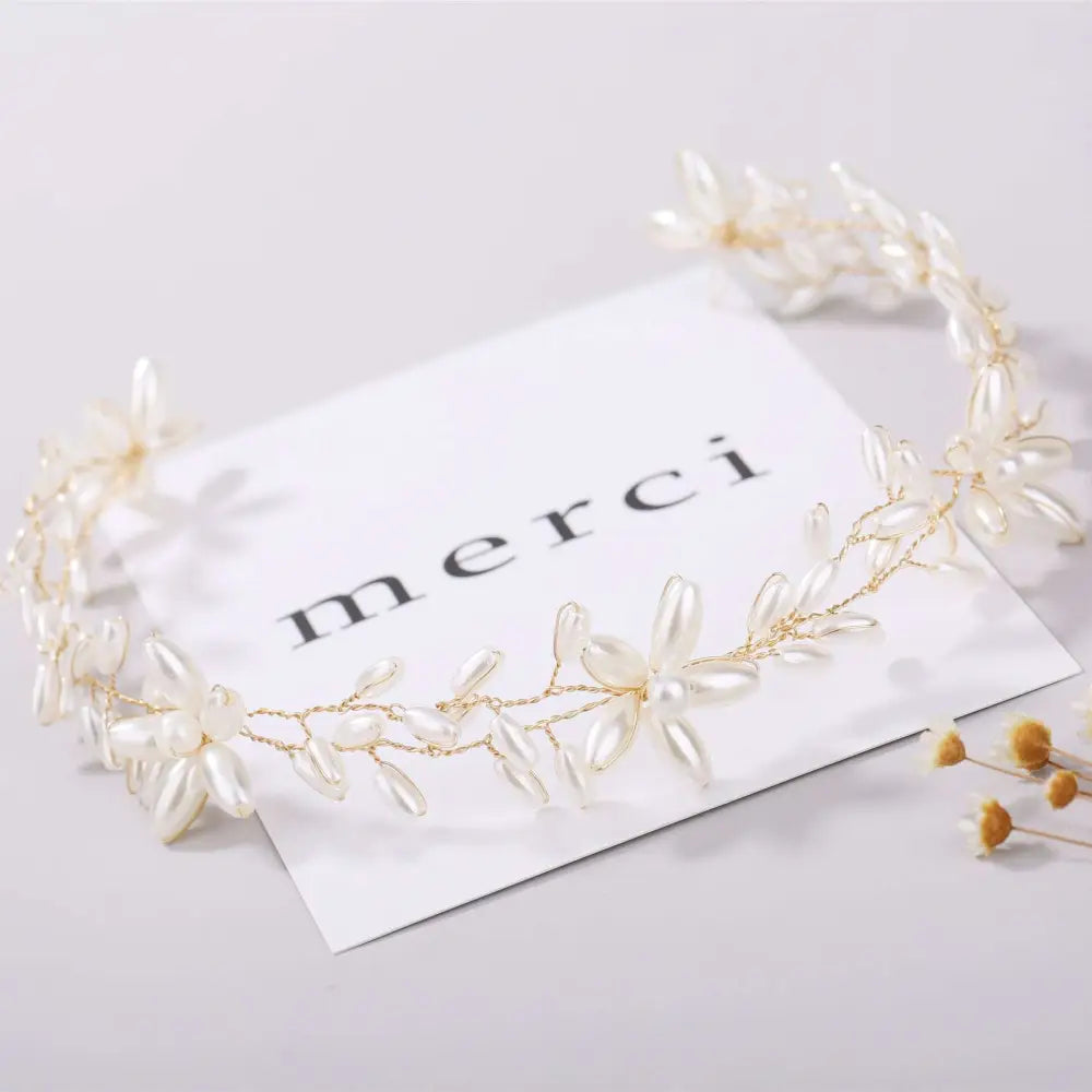 Elegant gold-toned handmade pearl twisted floral headpiece with delicate white pearls and intricate leaf designs