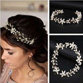 Elegant gold-toned handmade pearl twisted floral headpiece with delicate ivory pearls and metallic wirework details