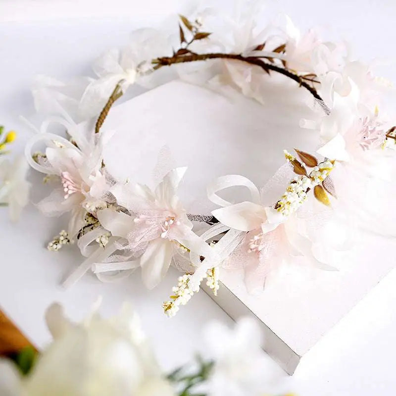 Handmade white rose bridal veil featuring a floral wreath with elegant white and blush flowers lace and dried accents