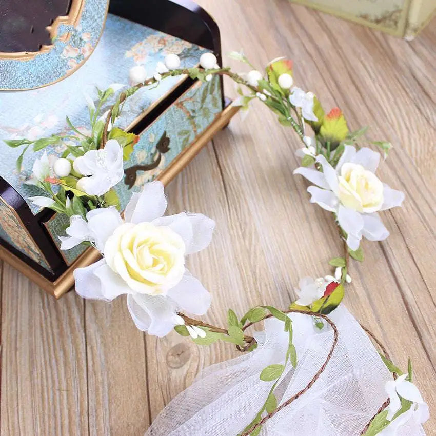 Handmade white rose bridal veil with delicate white floral wreath featuring artificial roses green leaves and berries