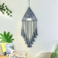 Gray handwoven home decor triangle dream catcher with intricate knotwork and delicate dream catcher tassels