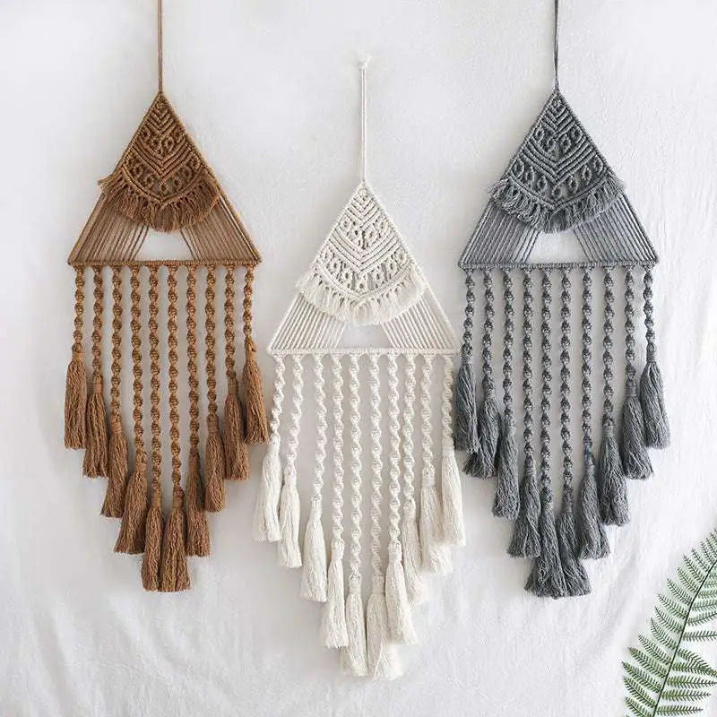 Three handwoven home decor triangle dream catcher tassels in earthy brown white and gray with intricate woven patterns
