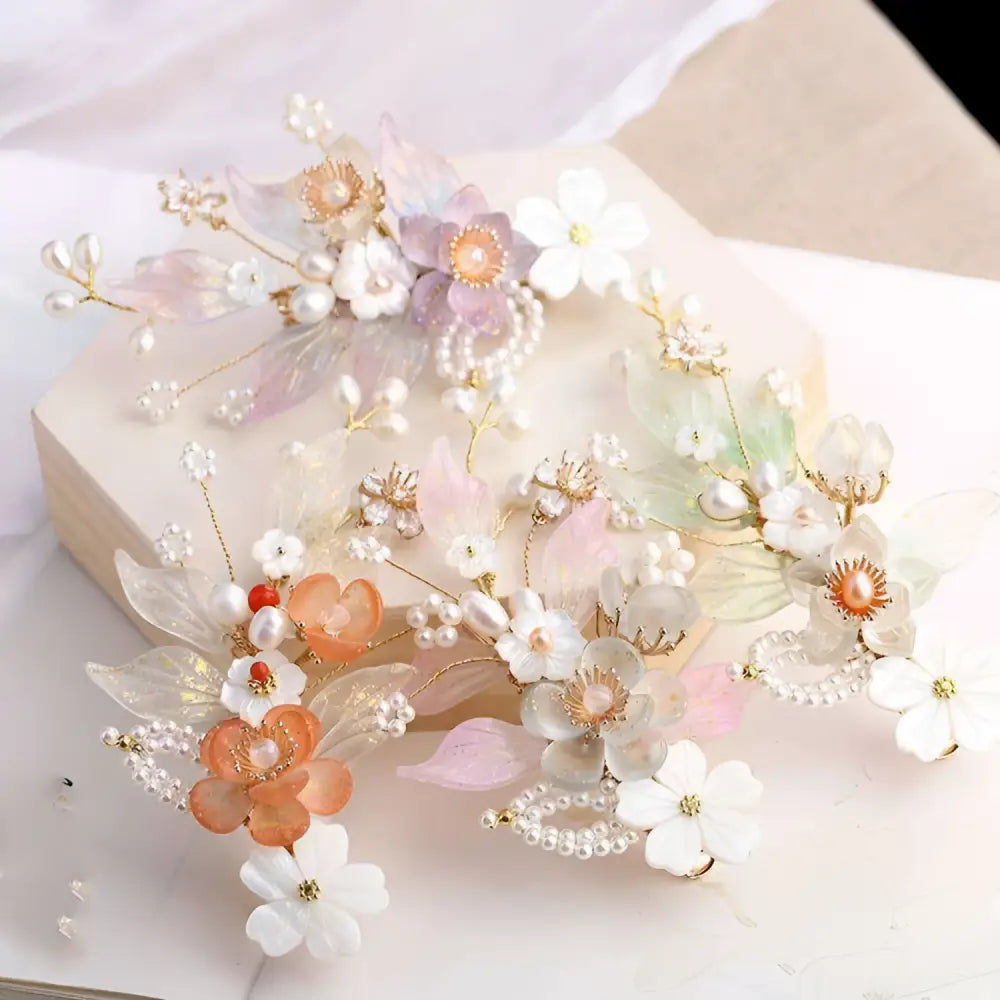 Hanfu ancient style handmade fringed floral hair crown with delicate pastel petals, pearl accents, and gold centers