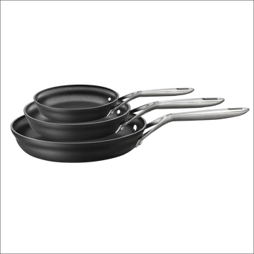 Set of three black hard anodized nonstick fry pans with stainless steel handles in a durable fry pan set