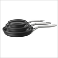 Set of three black hard anodized nonstick fry pans with stainless steel handles in a durable fry pan set
