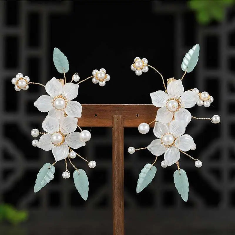 Elegant white floral bride Chinese luxury hairpins adorned with pearls and light blue jade leaves with matching drop earrings