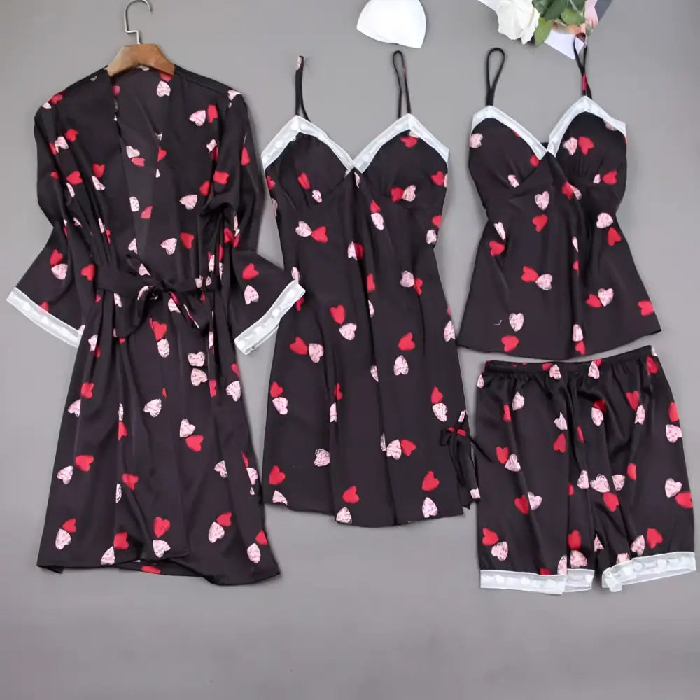 Black satin women’s silk slip nightdress with red and white heart print and lace trim on neckline and hem