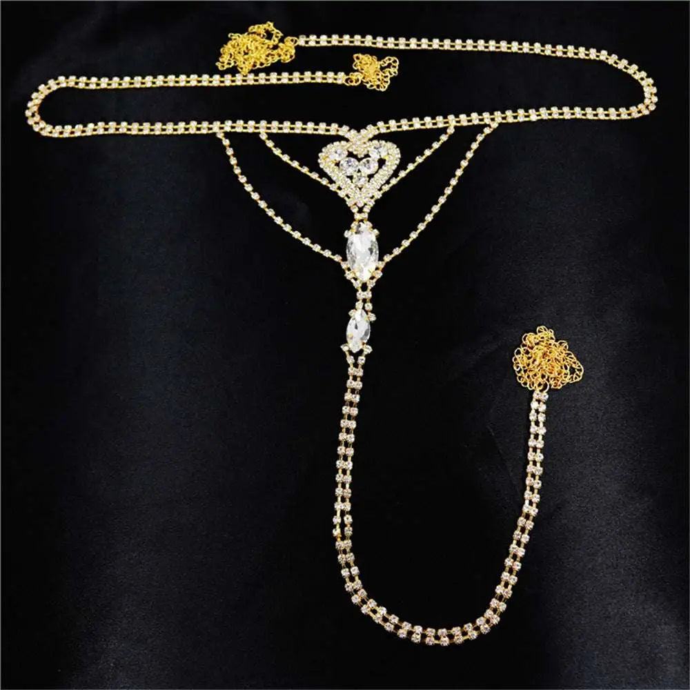 Gold-toned rhinestone panty body jewelry with heart centerpiece and garter belt featuring teardrop crystals