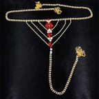 Gold-toned rhinestone panty body jewelry with central floral design in red and clear crystals and matching garter belt