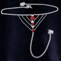 Silver chain panty body jewelry with red and clear rhinestones in floral design and attached garter belt