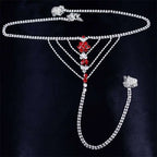 Silver chain panty body jewelry with red and clear rhinestones in floral design and attached garter belt