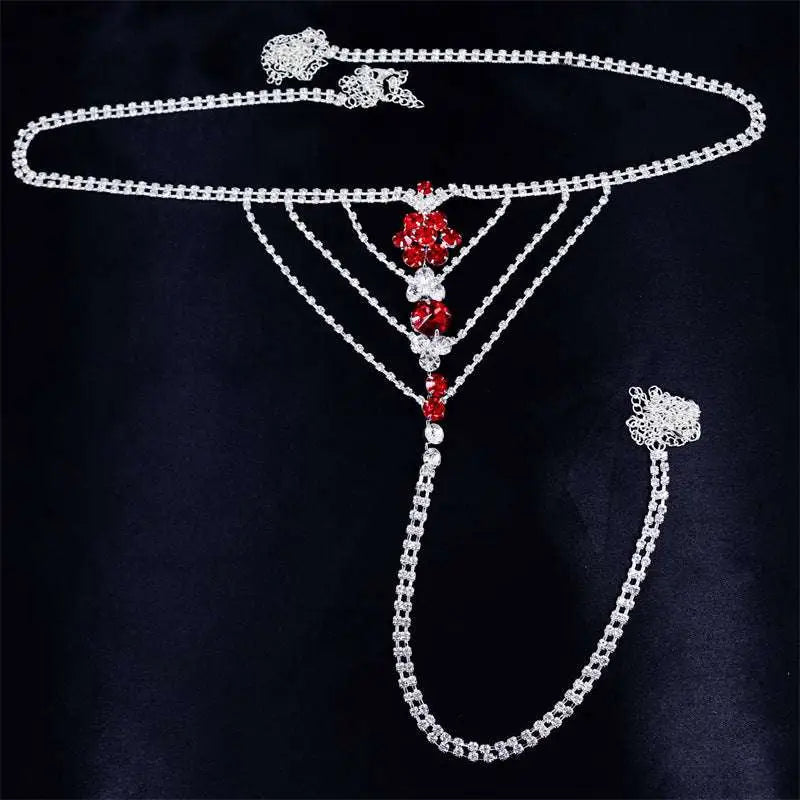 Silver chain panty body jewelry with red and clear rhinestones in floral design and attached garter belt