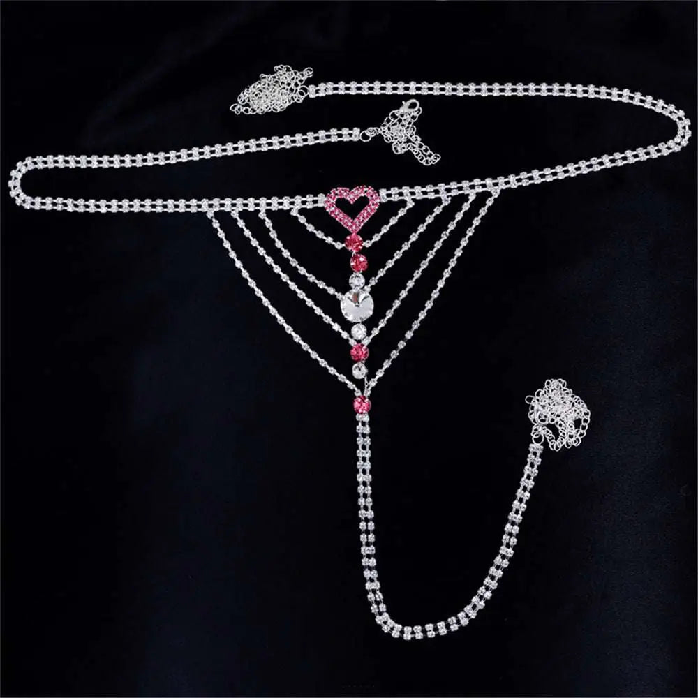 A sparkling silver rhinestone panty body jewelry with a central pink heart and matching garter belt adornment