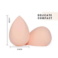 Soft peach-colored teardrop-shaped beauty egg makeup sponges with a smooth matte finish in heart shaped beauty gift box