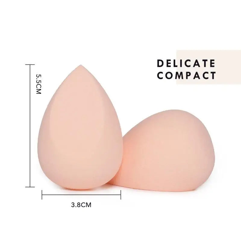 Soft peach-colored teardrop-shaped beauty egg makeup sponges with a smooth matte finish in heart shaped beauty gift box